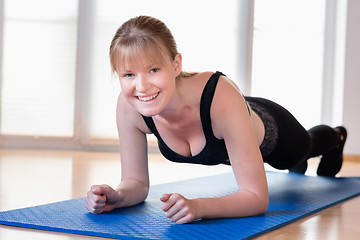 Image showing Girl doing plank exercises