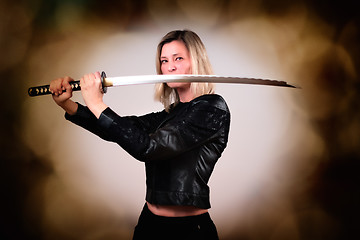 Image showing Female fighter with sword