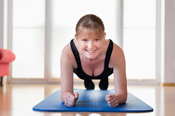 Image showing Girl doing plank exercises