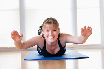 Image showing Girl does exercise to strengthen her back