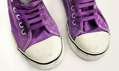 Image showing Old lilac sneakers, close-up