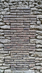 Image showing Ancient wall with bricks and cobblestones