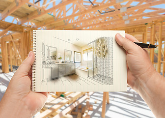 Image showing Hands Holding Pen and Pad of Paper with Bathroom Design Inside H