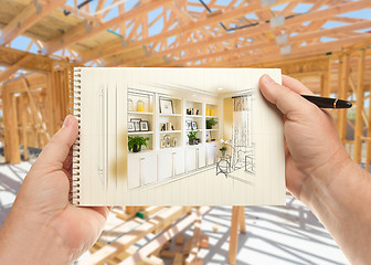 Image showing Hands Holding Pen and Pad of Paper with Built-in Shelves and Cab