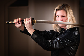 Image showing Female fighter with sword