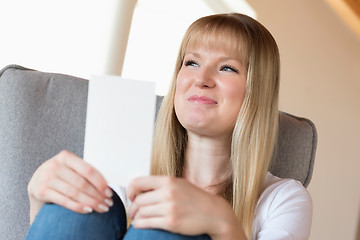 Image showing Woman holding photo