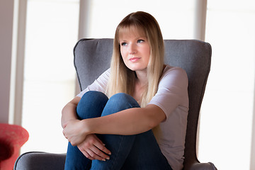 Image showing Sad girl sitting on chair