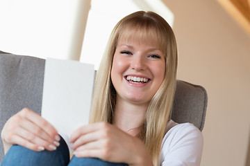 Image showing Woman holding photo