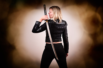 Image showing Female fighter with sword