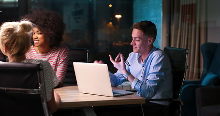 Image showing Multiethnic startup business team in night office