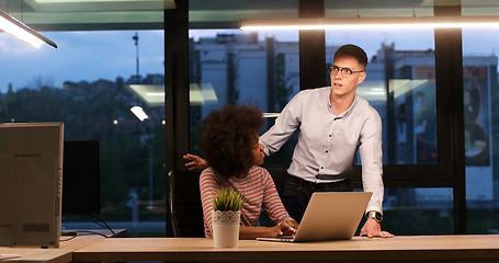 Image showing Multiethnic startup business team in night office