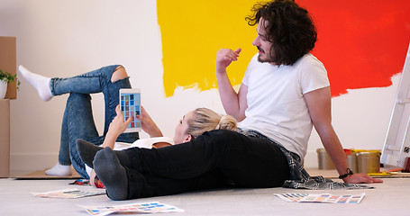 Image showing Happy young couple relaxing after painting