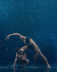 Image showing Young couple of ballet dancers dancing unde rwater drops