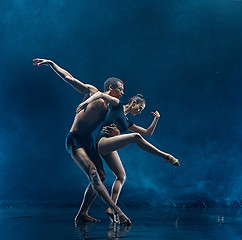 Image showing Young couple of ballet dancers dancing unde rwater drops