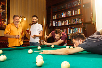 Image showing Close-up shot of a man playing billiard