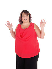 Image showing Surprised woman with hands raised