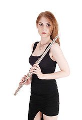 Image showing Woman standing and holding her flute