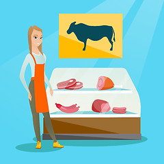 Image showing Butcher offering fresh meat in the butcher shop.