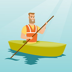 Image showing Young caucasian man travelling by kayak.