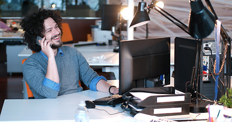 Image showing businessman working using a computer in startup office