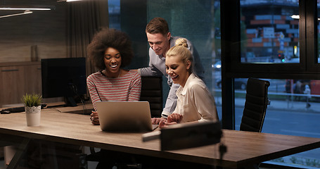 Image showing Multiethnic startup business team in night office