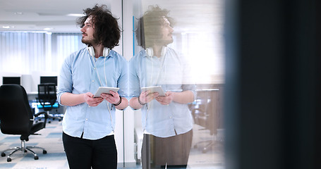 Image showing businessman using tablet computer