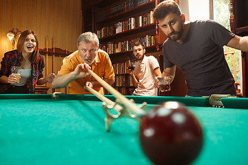 Image showing Close-up shot of a man playing billiard