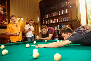 Image showing Close-up shot of a man playing billiard