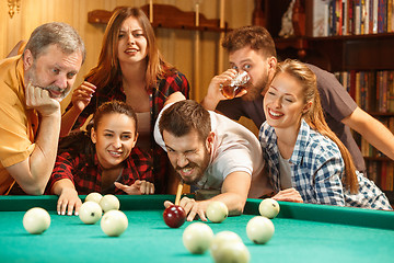 Image showing Close-up shot of a man playing billiard