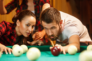 Image showing Close-up shot of a man playing billiard