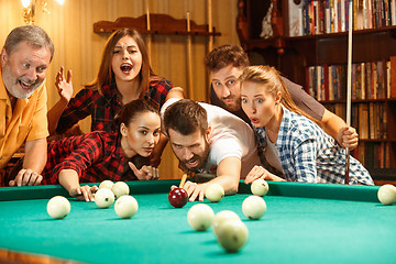 Image showing Close-up shot of a man playing billiard