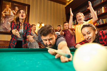 Image showing Close-up shot of a man playing billiard