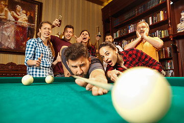 Image showing Close-up shot of a man playing billiard