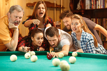 Image showing Close-up shot of a man playing billiard