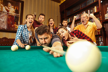 Image showing Close-up shot of a man playing billiard