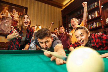 Image showing Close-up shot of a man playing billiard