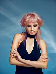 Image showing Close-up indoor portrait of lovely girl with blonde hair. Studio shot of graceful young woman with short haircut