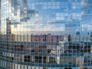 Image showing Beautiful sunset reflecting in the windows facade of modern office business building.