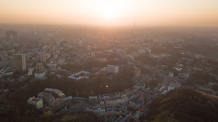 Image showing Skyline bird eye aerial view of the city center with an art college and a television tower under dramatic sunset sky in Kiev, Ukraine