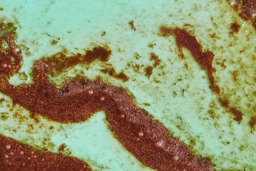 Image showing Decorative background from melted ice cream in a green and brown tones.