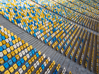 Image showing KYIV, UKRAINE - July 19, 2018. Aerial view empty tribunes of NSC Olimpiysky before the game in blue and yellow colors