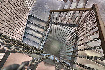 Image showing The staircase with a view from the top down is the building