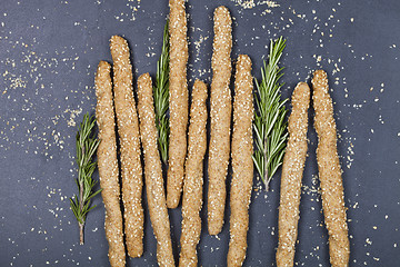 Image showing Italian grissini or salted bread sticks with sesame and rosemary