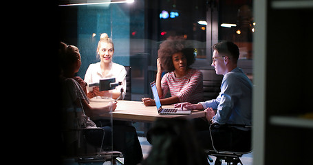 Image showing Multiethnic startup business team in night office