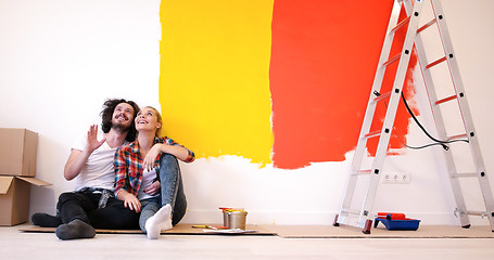 Image showing Happy young couple relaxing after painting