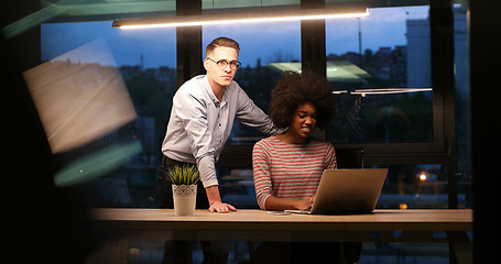 Image showing Multiethnic startup business team in night office