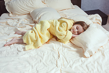 Image showing The child little girl sleeping in the bed