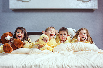 Image showing The group of friends taking goog time on bed