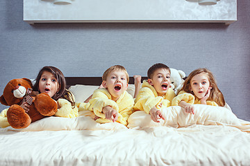 Image showing The group of friends taking goog time on bed