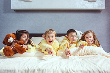 Image showing The group of friends taking goog time on bed